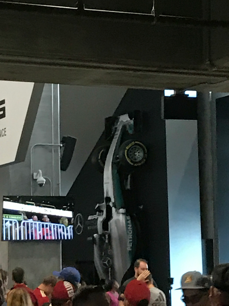 Just an old f1 car casually hanging off the side of a wall